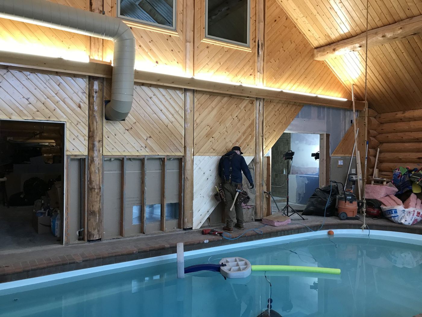 Indoor pool room framed in timber with a wood ceiling